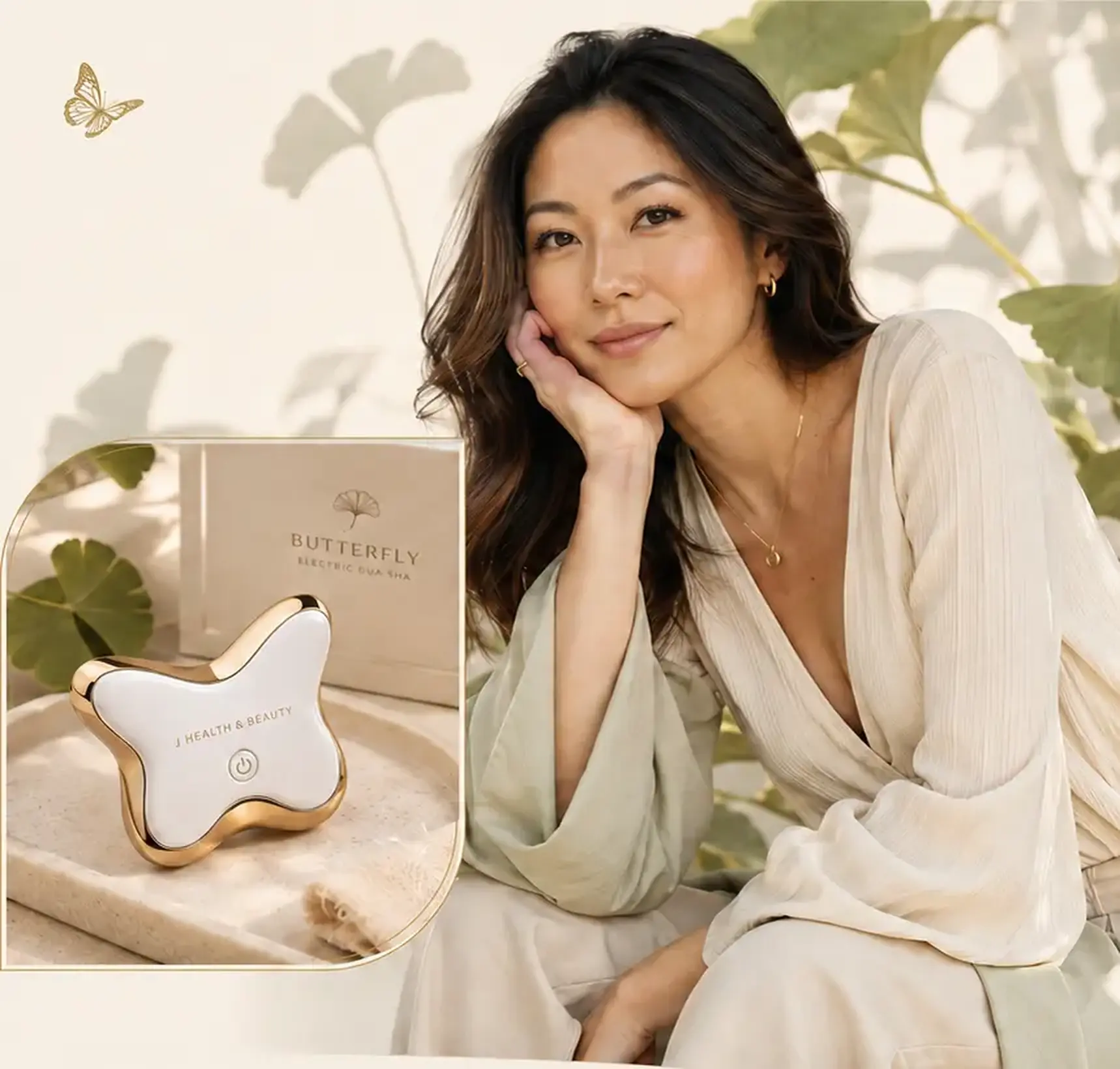 June beside the Butterfly electric gua sha, its packaging and fresh ginkgo leaves